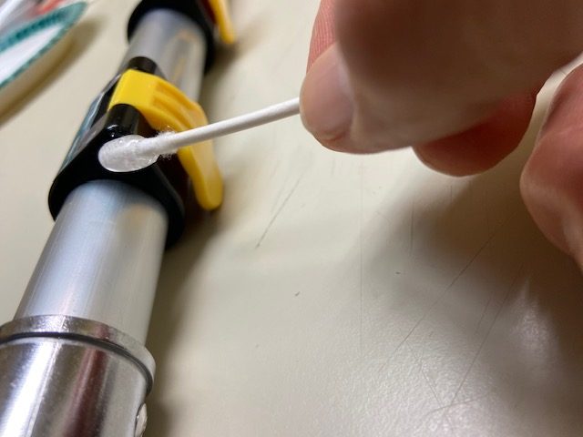 Adhesive Being Applied To Secure A Roll Pin On A Saw Trax Pocket Reacher Rotated